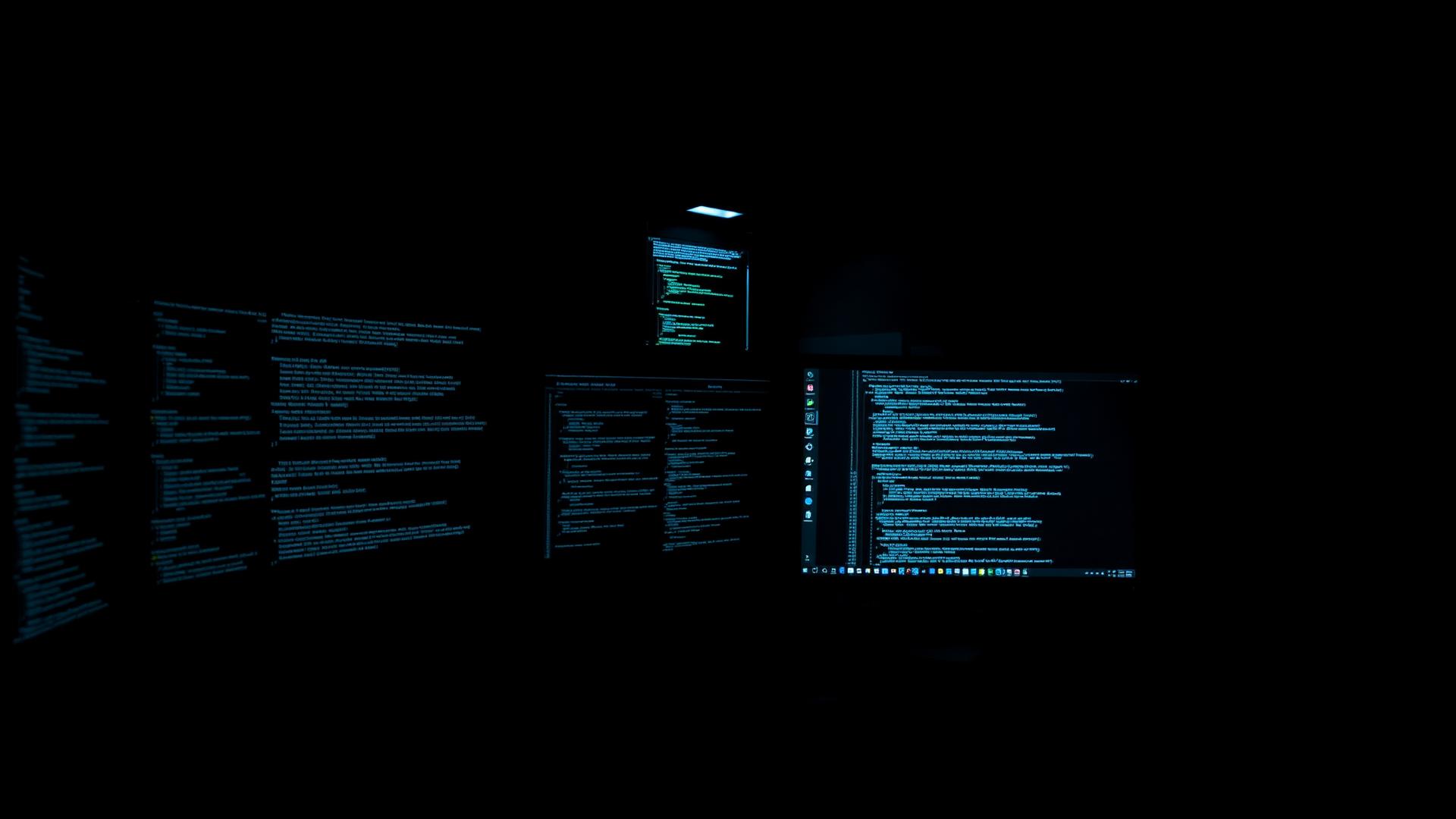 Poste de travail avec du code à l'écran et du matériel serveur